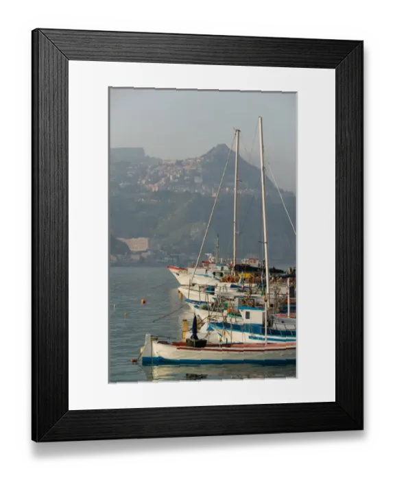 Framed Print : ITALY-Sicily-GIARDINI-NAXOS: Port view towards TAORMINA  /  Late Afternoon