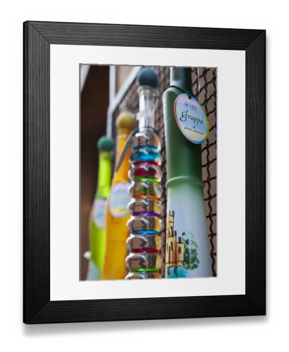 Framed Print : ITALY, Brescia Province, Sirmione. Ornate bottles of grappa Framed Print : ITALY, Brescia Province, Sirmione. Ornate bottles of grappa