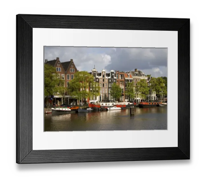 Framed Print : Row houses along the Amstel River in Amsterdam, Netherlands Framed Print : Row houses along the Amstel River in Amsterdam, Netherlands