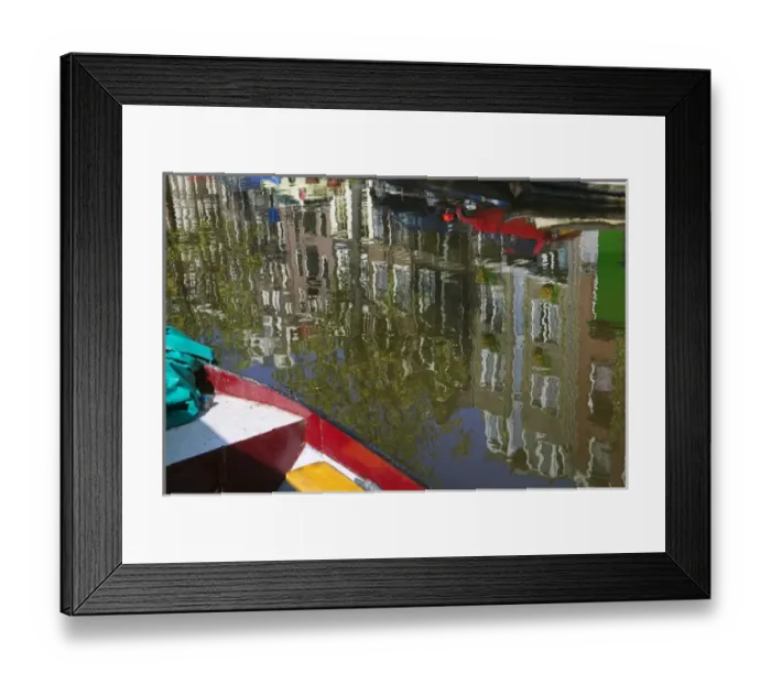 Framed Print : Reflection of boat and houses in water along canal belt, Amsterdam, Netherlands Framed Print : Reflection of boat and houses in water along canal belt, Amsterdam, Netherlands