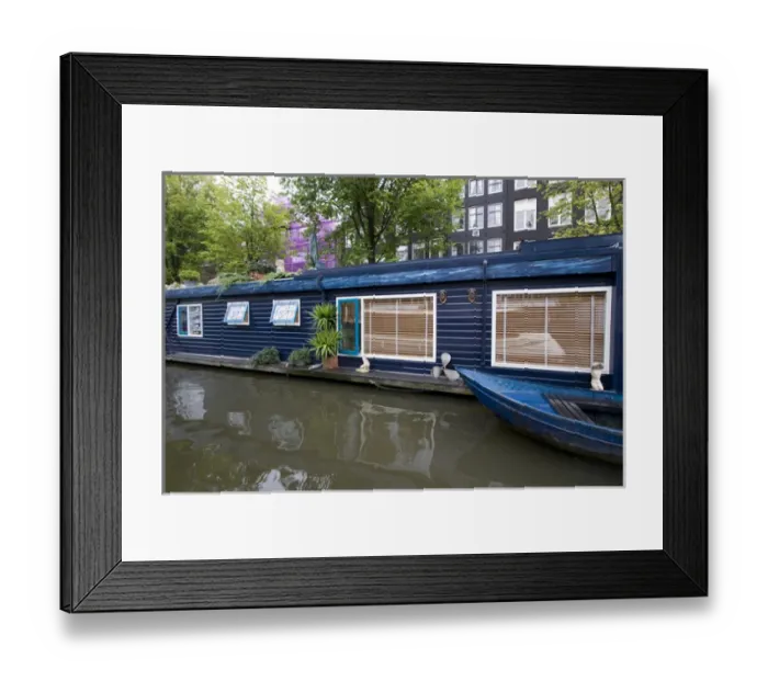Framed Print : a colorful blue houseboat with matching row boat on a canal Framed Print : a colorful blue houseboat with matching row boat on a canal