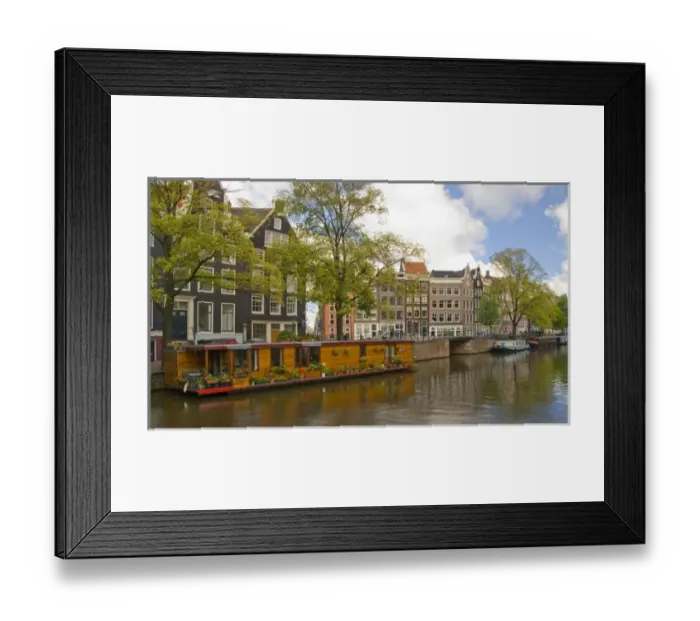 Framed Print : A wooden houseboat with lots of flowers on Prinsengracht Canal with colorful buildings Framed Print : A wooden houseboat with lots of flowers on Prinsengracht Canal with colorful buildings