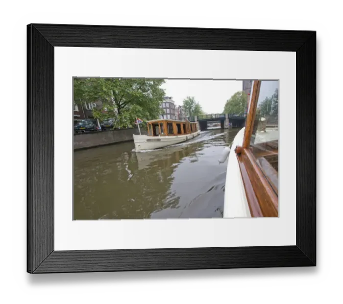 Framed Print : Wood panaled boats pass eachother on a canal near a bridge Framed Print : Wood panaled boats pass eachother on a canal near a bridge