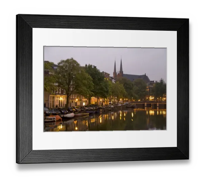 Framed Print : Street lights reflect onto the canal at dusk with a lit bridge and De Krijtberg in Framed Print : Street lights reflect onto the canal at dusk with a lit bridge and De Krijtberg in