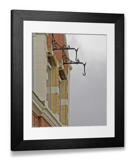 Framed Print : Hooks hanging from brick building in Amsterdam for pully system Framed Print : Hooks hanging from brick building in Amsterdam for pully system