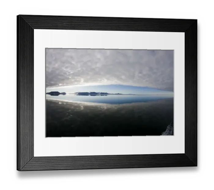 Framed Print : Norway, Svalbard, Edgeoya Island, Reflection of low clouds in calm sea on summer