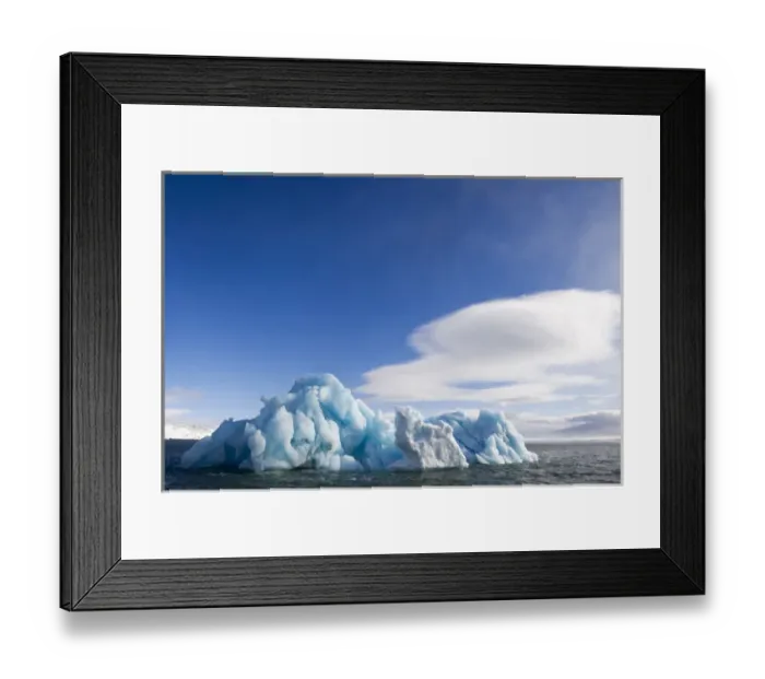 Framed Print : Norway, Svalbard, Nordaustlandet, Deep blue iceberg floating in Palanderbukta Bay