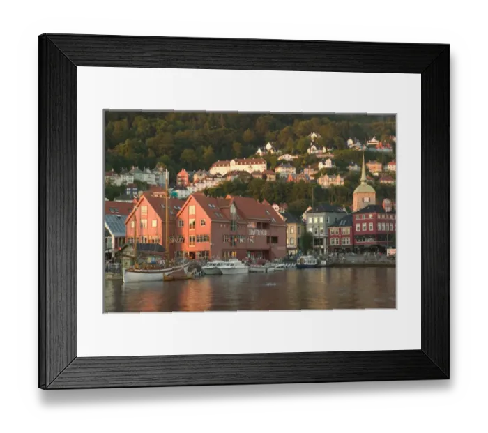 Framed Print : Kos Church tower behind the ancient buildings of Bergens harbor in evening light