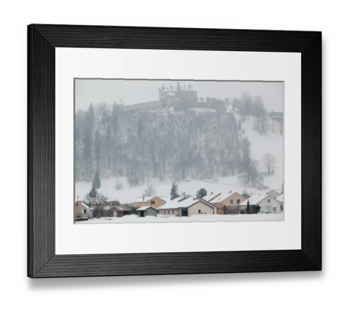 Framed Print : SWITZERLAND-Fribourg-GRUYERES: Gruyeres Castle (15th century) from Lower Town  /  Winter
