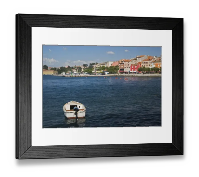 Framed Print : Single small boat docked in the harbor at Rovigno, Croatia Framed Print : Single small boat docked in the harbor at Rovigno, Croatia