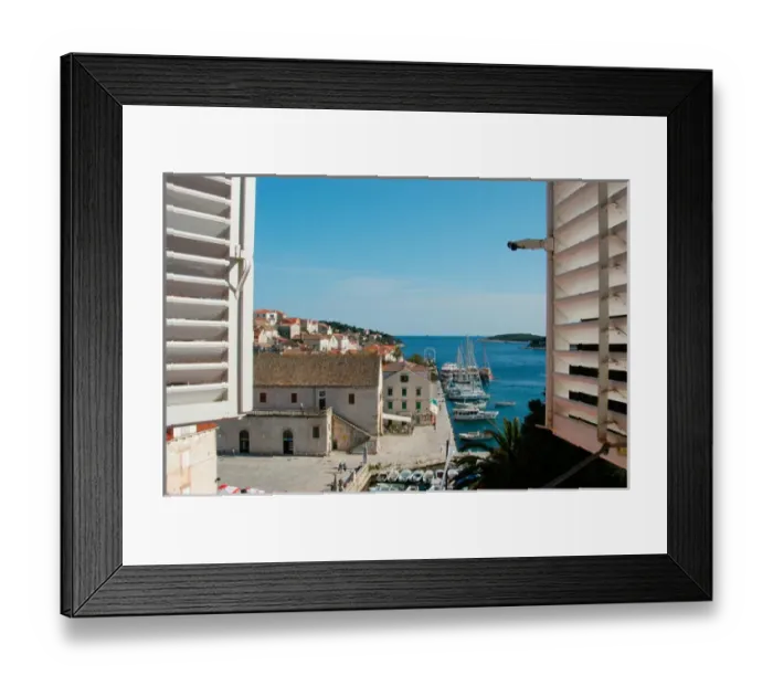 Framed Print : Croatia, Dalmatian Coast, Hvar, view of the harbor, boats and Riva seen thru shuttered Framed Print : Croatia, Dalmatian Coast, Hvar, view of the harbor, boats and Riva seen thru shuttered
