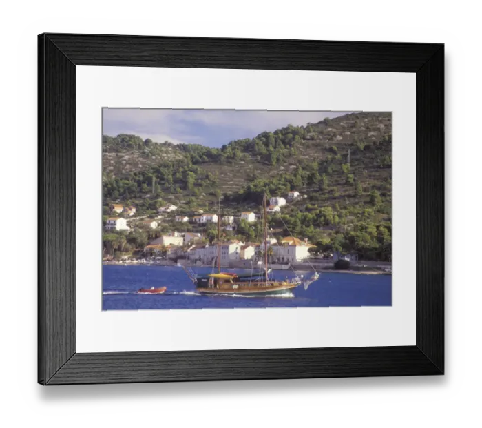Framed Print : A ship sails into harbor at Vis Town. Vis Island. Croatia. NR