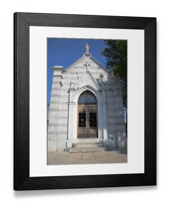 Framed Print : Cres, Coatia - Low angle view of old world church. Vertical shot