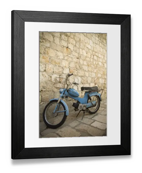 Framed Print : Europe, Croatia, Dalmatia, Hvar Island, Hvar town, blue scooter bike by old stone wall