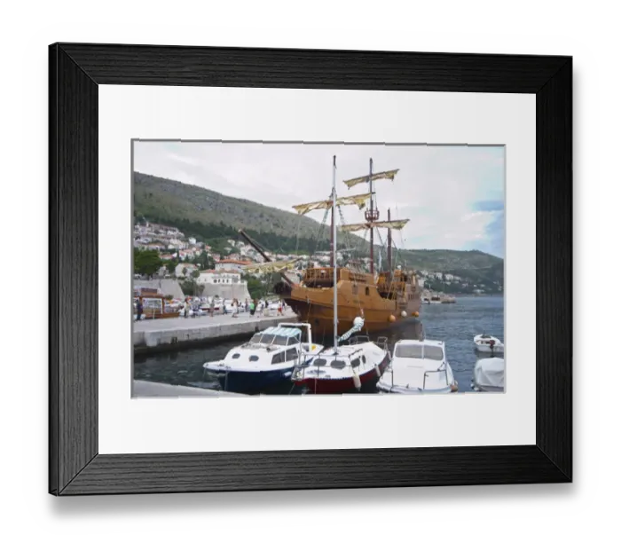 Framed Print : The Karaka 16 century galleon replica boat in the old harbour. Other boats moored