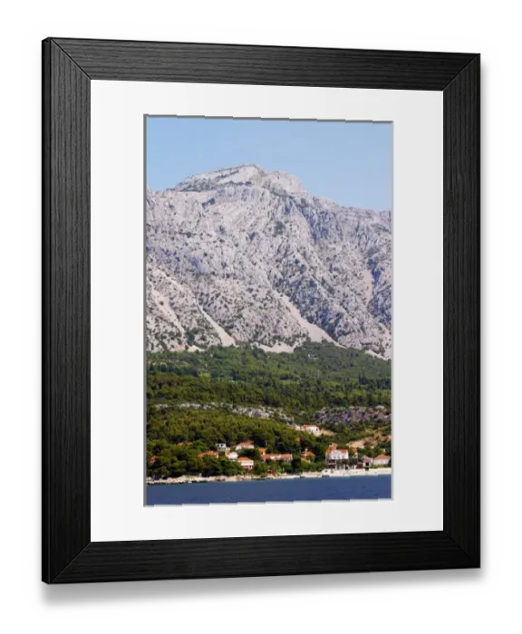 Framed Print : Mountain top of the Mount Sveti Ilija, with white rock formations. At sea level the Orebic village