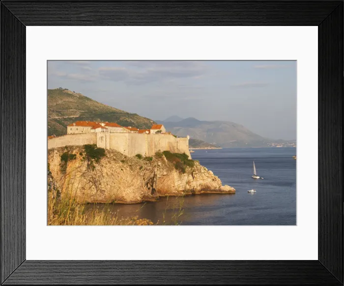Framed Print : A view of the Lovrijenac Fort and the sea, mountains in the background Dubrovnik, old city