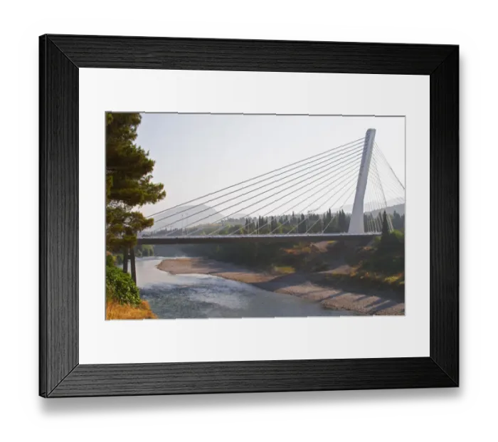 Framed Print : The Millennium Bridge is a cable bridge that spans Moraca River and a single central Framed Print : The Millennium Bridge is a cable bridge that spans Moraca River and a single central