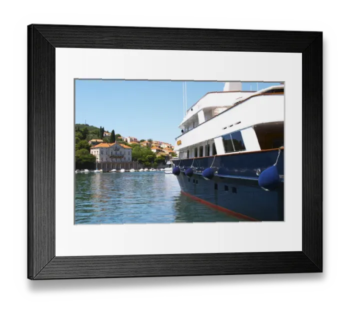 Framed Print : American registered yacht with flag, with villas in the background, moored at the dock key Framed Print : American registered yacht with flag, with villas in the background, moored at the dock key