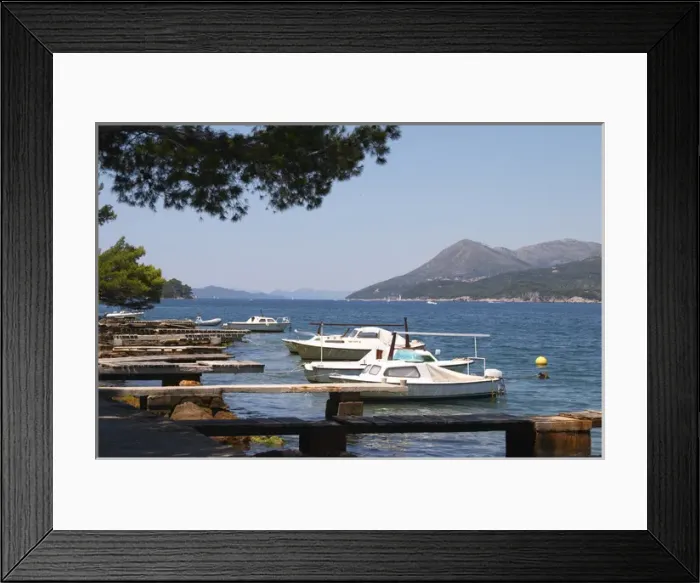 Framed Print : Small pleasure boats moored on jetty jetties looking out to the Kanal Daksa canal Framed Print : Small pleasure boats moored on jetty jetties looking out to the Kanal Daksa canal