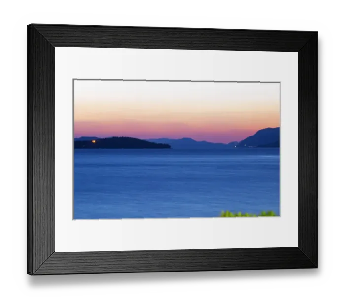 Framed Print : Sunset over the sea. View over the islands Daksa and others. House lights. Dark blue sea
