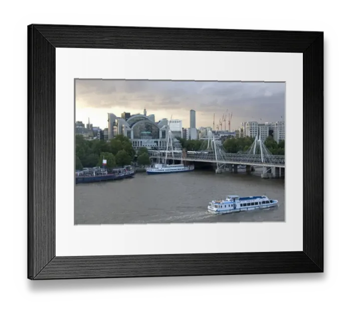 Framed Print : Charing Cross railway station at the north end of the Hungerford Bridge and Golden