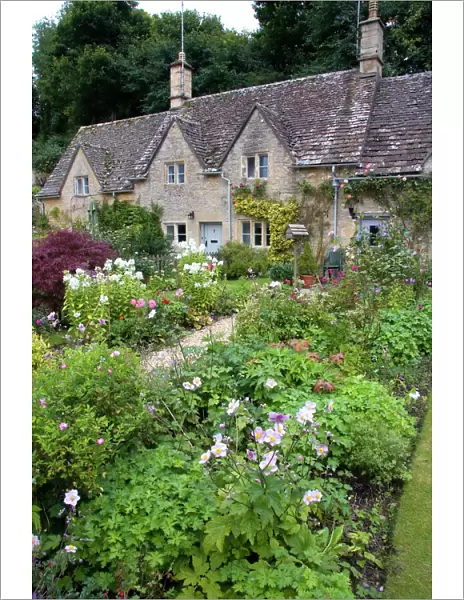 Cotswold stone cottage and garden in Bibury, Gloucestershire, England
