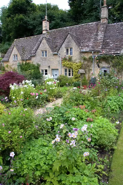 Cotswold stone cottage and garden in Bibury, Gloucestershire, England