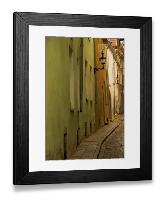 Framed Print : Europe, Estonia, Tallinn. Narrow cobblestone street with lamps on buildings. Credit as