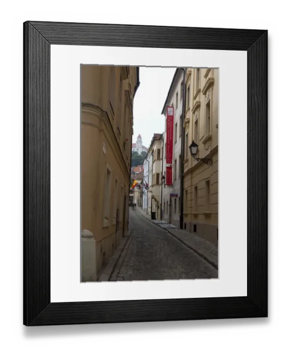 Framed Print : Slovakia, Bratislava. Narrow street in historic district with view of Bratislava Framed Print : Slovakia, Bratislava. Narrow street in historic district with view of Bratislava