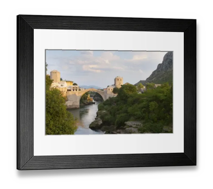 Framed Print : View along the river of the old reconstructed bridge. Sunset late afternoon light