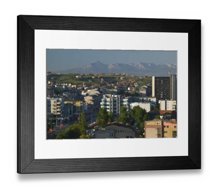 Framed Print : KOSOVO, Prishtina. Downtown Prishtina and the Albanian Mountains to the South  /  Morning
