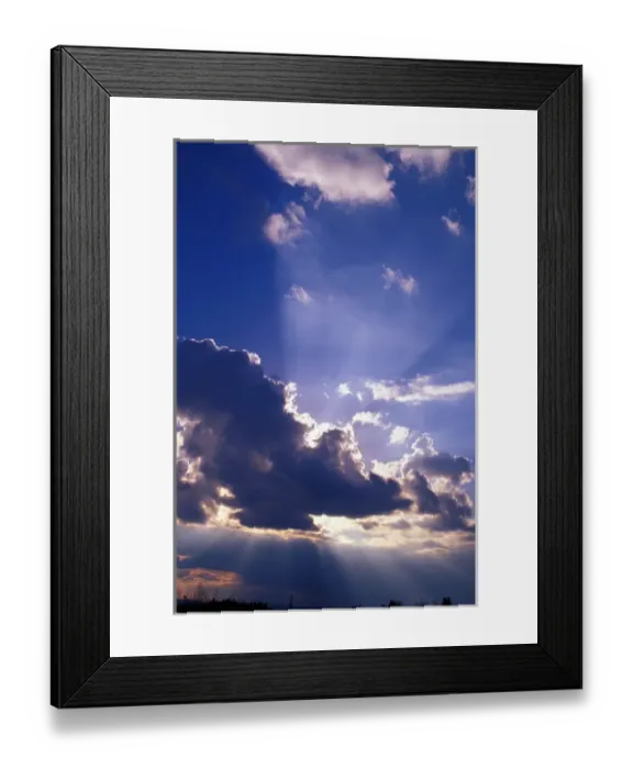 Framed Print : Sun rays radiate from the edges of the cloud Framed Print : Sun rays radiate from the edges of the cloud