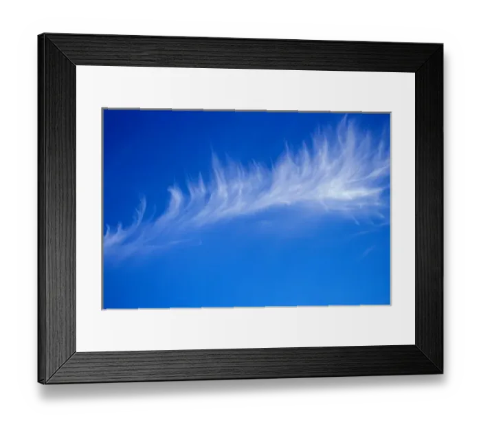 Framed Print : A light whispy cloud hang in the bright blue sky Framed Print : A light whispy cloud hang in the bright blue sky