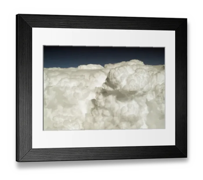 Framed Print : View of puffy, white clouds from an airplane