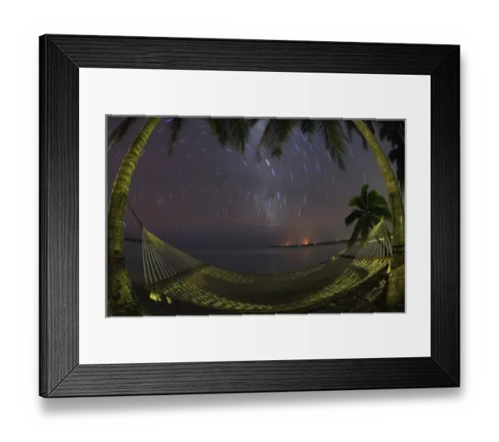 Framed Print : South Pacific, Cook Islands, Aitutaki. Stars rotate around the South Pole above a Framed Print : South Pacific, Cook Islands, Aitutaki. Stars rotate around the South Pole above a