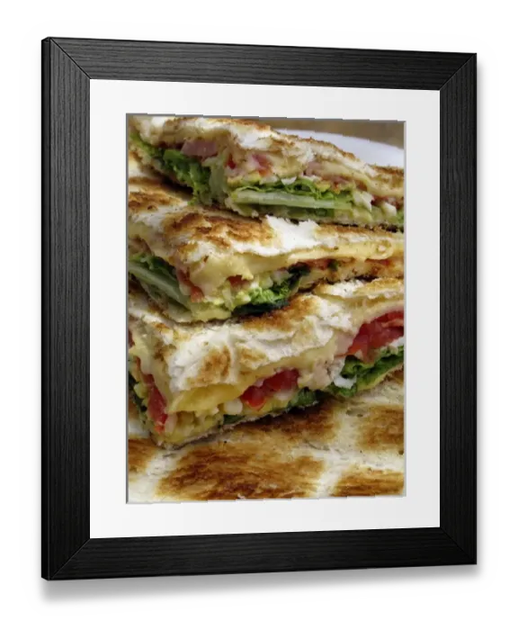Framed Print : Tostado is a tipical Argentine snack: toasted bred stuffed with cheese, ham, tomatos Framed Print : Tostado is a tipical Argentine snack: toasted bred stuffed with cheese, ham, tomatos
