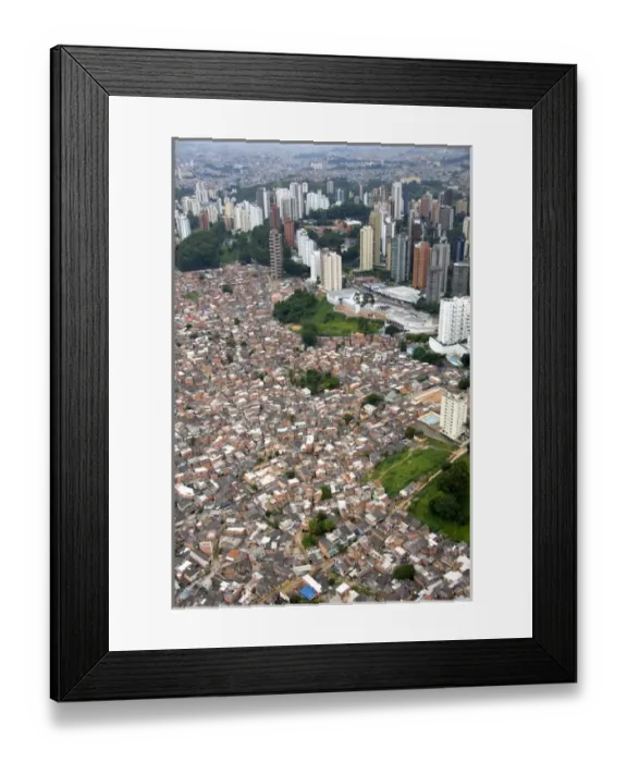 Framed Print : Aerial view of crowded favela housing contrasts with modern apartment buildings in Sao Paulo Framed Print : Aerial view of crowded favela housing contrasts with modern apartment buildings in Sao Paulo