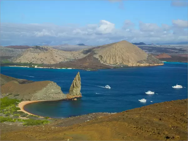 Landscape of island and yachts on ocean, Santiago, Galapagos Islands, Ecuador