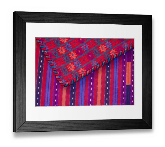 Framed Print : Central America, Guatemala, Antigua. Colorful weavings for sale in shop in Antigua