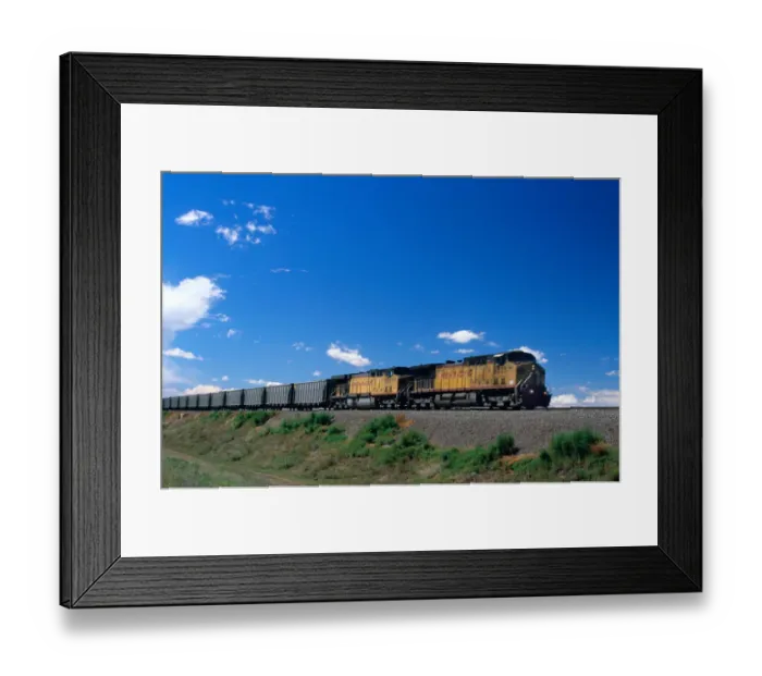 Framed Print : Union Pacific train traveling on a railroad track in Nebraska. union pacific Framed Print : Union Pacific train traveling on a railroad track in Nebraska. union pacific
