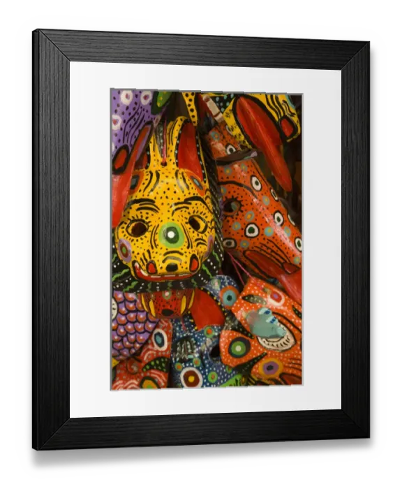 Framed Print : Central America, Guatemala, Antigua. Painted masks for sale in handicraft market