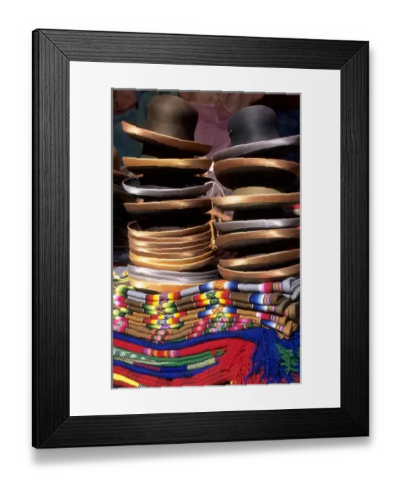 Framed Print : Peru. Pile of felt hats with satin rims on a pile of woven mantas Framed Print : Peru. Pile of felt hats with satin rims on a pile of woven mantas
