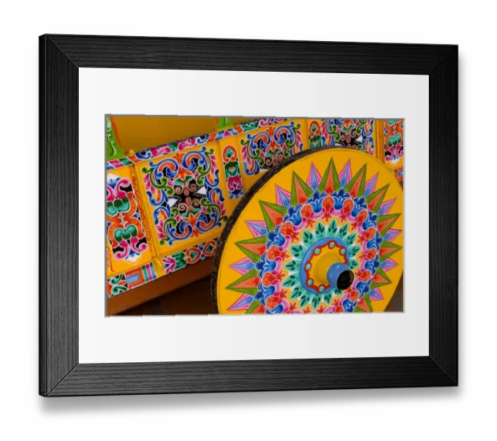 Framed Print : Colorful close up of famous wheel for carriages that are traditional in and around Framed Print : Colorful close up of famous wheel for carriages that are traditional in and around