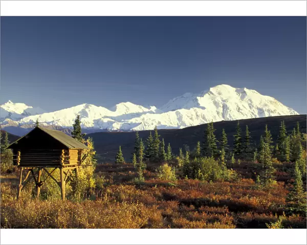 NA, USA, Alaska. Denali National Park. Denali and traditional Alaskan log cache