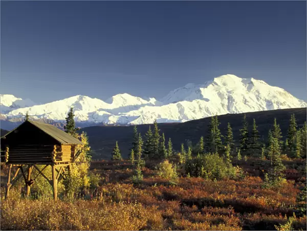 NA, USA, Alaska. Denali National Park. Denali and traditional Alaskan log cache