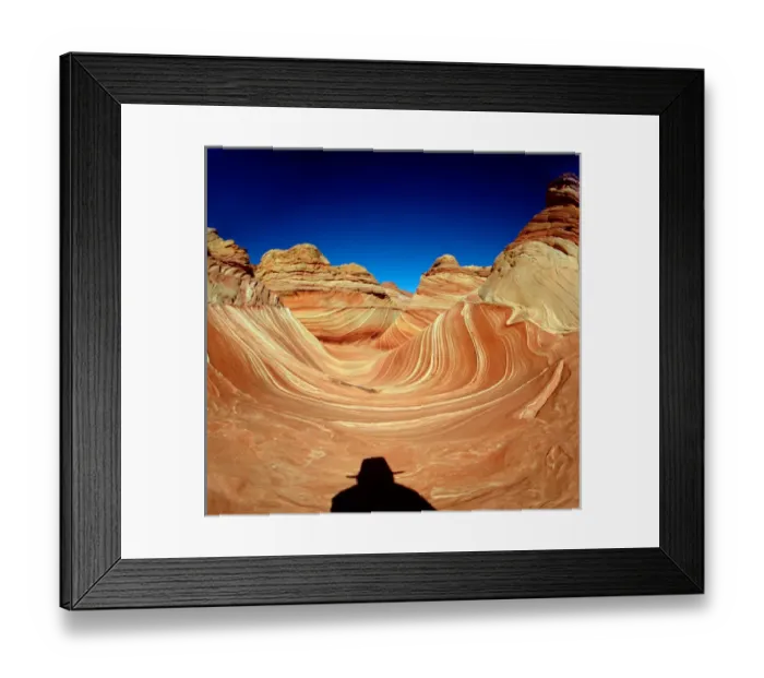 Framed Print : Hiker in the Wind and water eroded Navajo sandstone in Coyote Buttes North, Paria Framed Print : Hiker in the Wind and water eroded Navajo sandstone in Coyote Buttes North, Paria