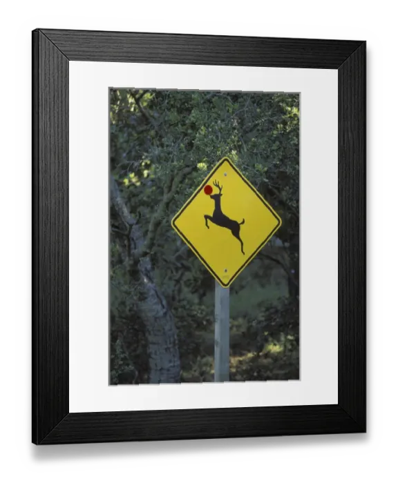 Framed Print : USA, California. A prankster converted a deer crossing sign into a Rudolph the reindeer