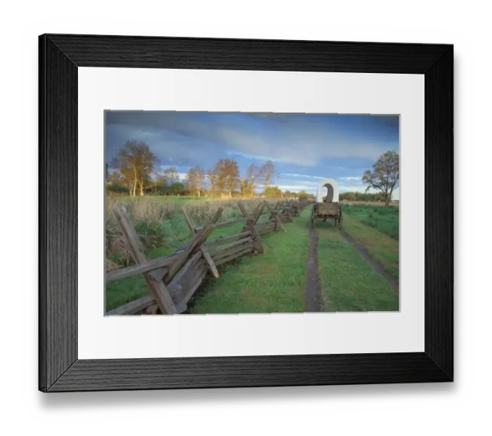 Framed Print : A replica wagon at sunrise along the Original Oregon Trail found at Whitman Mission