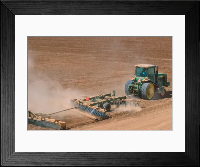 Framed Print : Crawler type tractor discing a field in preparation for planting in the Central Valley Framed Print : Crawler type tractor discing a field in preparation for planting in the Central Valley